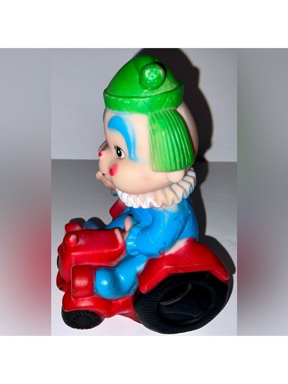 Vintage Squeaky toy - clown riding a red tractor - made in Taiwan